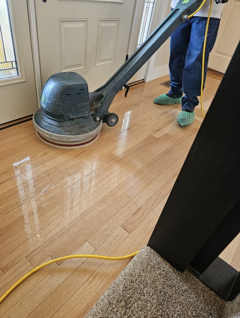 Professional floor cleaning equipment used on hardwood floors and carpet transition, demonstrating eco-friendly cleaning services by A Better Way to Clean in Boise, Idaho.